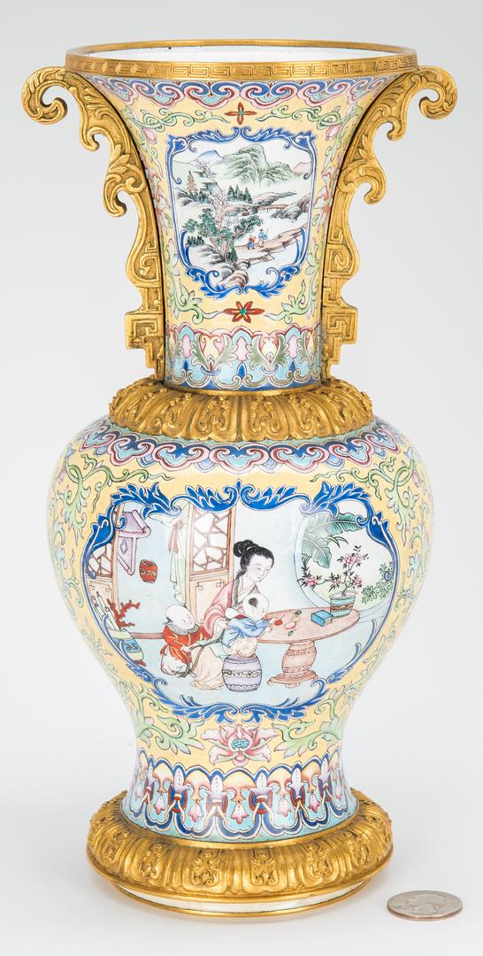 Canton Enamel Vase with Gilt Mounts: Good quality Chinese Canton Enamel Vase on yellow ground with gilt bronze mounts. Flaring neck with ormolu fret mount over an enameled landscape scene flanked by ormolu fret and scroll handles; the bo