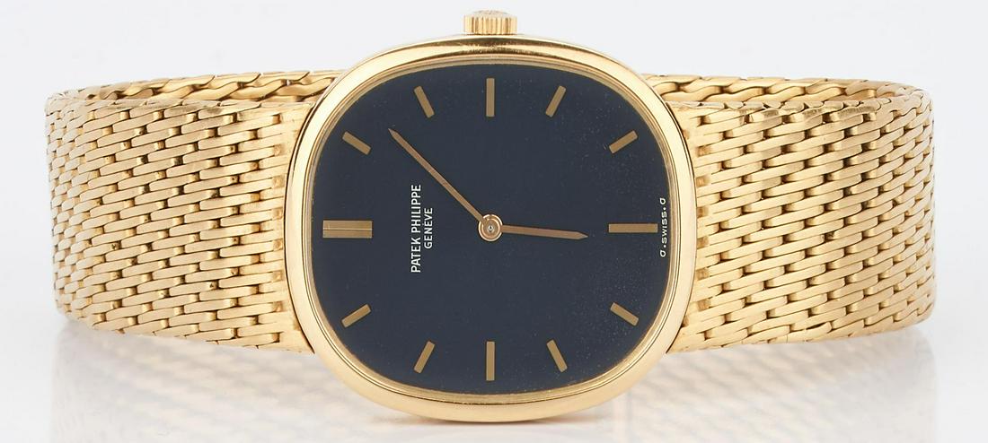 Men's 18K Yellow Gold Patek Philippe Watch: Men's 18K yellow gold Patek Philippe wristwatch, Golden Ellipse Model #3548, Serial #2697942, jewel manual wind movement, cobalt blue dial. Case measures approximately 32 x 26.5mm and has an 18K yello