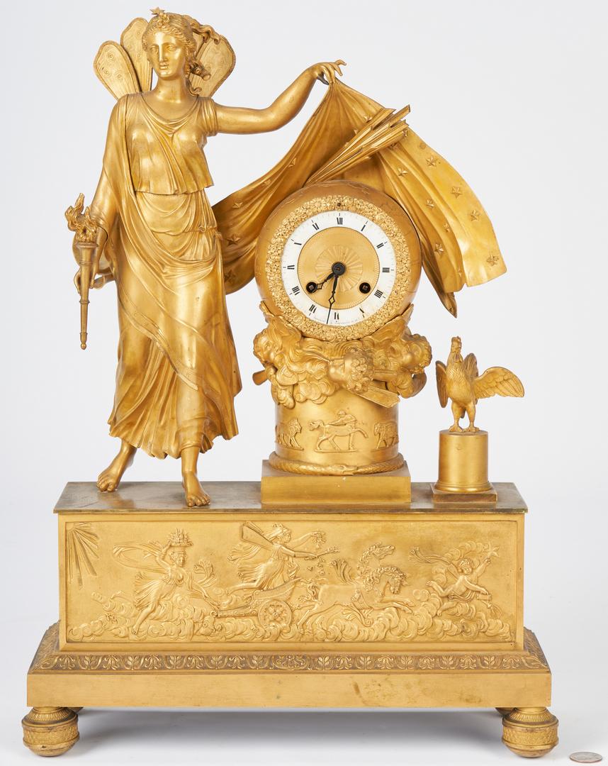 French Ormolu Figural Clock, Astor history: Neoclassical French gilt-bronze figural clock, circa 1820, decorated with symbols of the dawning of a new day. At left stands a winged female figure of Aurora, holding a torch and lifting the veil of 