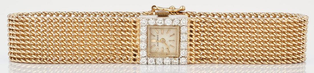 Ladies 14K Yellow Gold Movado Watch: Ladies 14K yellow gold Movado watch having a square face with 20 round brilliant cut diamonds approximately 1.0 carats, SI2 clarity, and H color, as well as an integral gold mesh bracelet. 17 jewel me