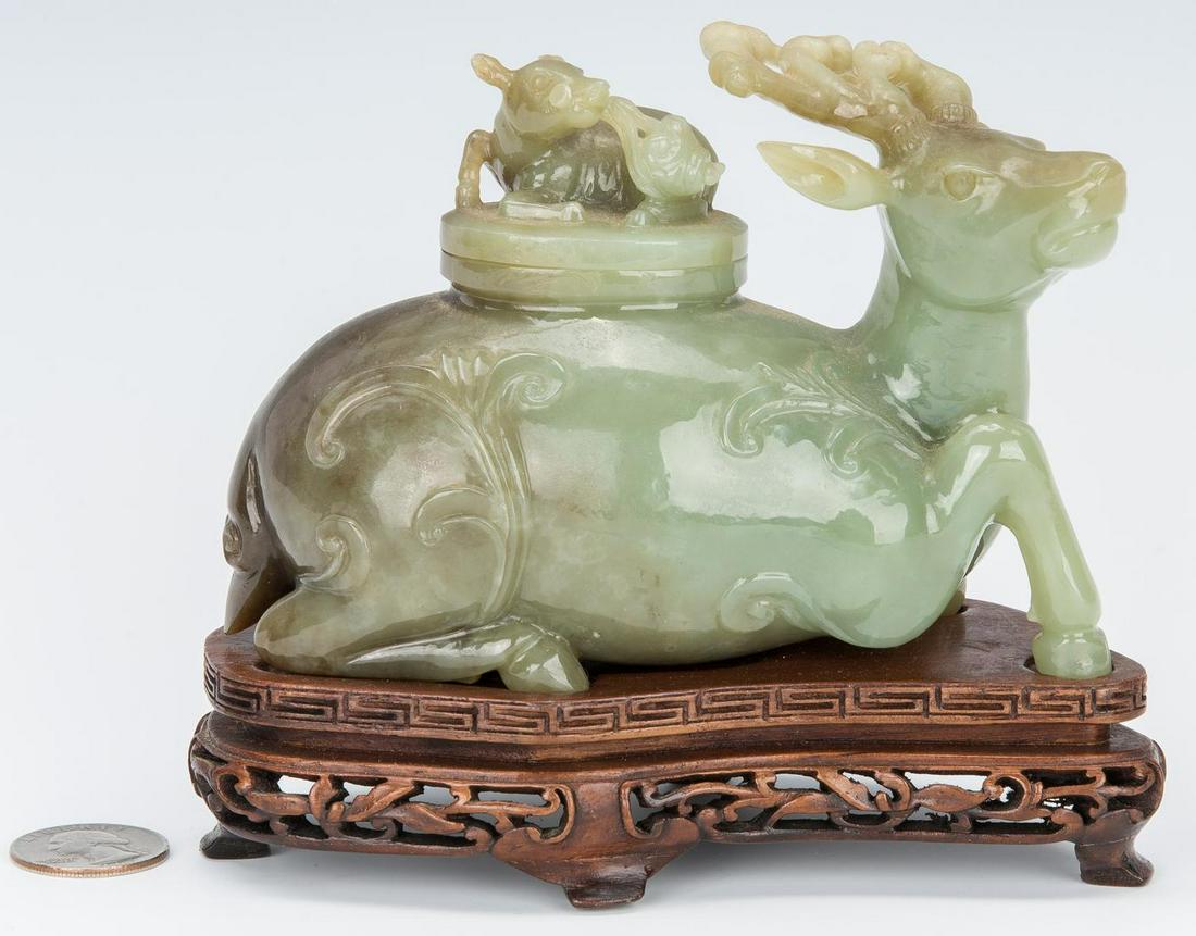 Chinese Jade Carved Figural Box, Deer w/ Deer Top: Carved Chinese green jade figural box in the form of a recumbant deer and the deer with a figural top depicting a small deer with Lingzhi. Fitted with a custom carved and pierced footed hardwood stand