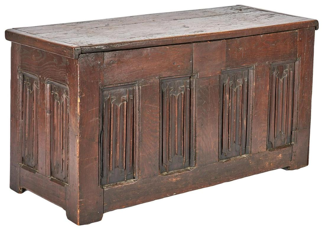 Early Oak Coffer with Linenfold Panels: Early carved oak blanket chest or coffer, pegged construction, rectangular hinged top with cleated ends over a case with four carved linenfold panels to front and two linenfold panels on each side. Fe