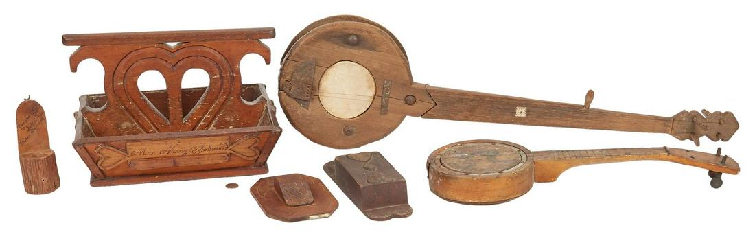 Southern Folk Art Box, 2 banjos, 3 Match Safes: Six (6) Southern Wooden Folk Art items, including cutlery box, miniature banjos, and wall pockets. 1st-2nd items: Two (2) miniature banjos, including one (1) four string banjo with square mother of pe