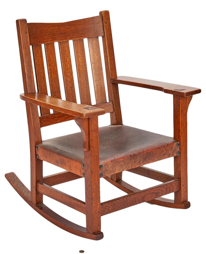 Gustav Stickley Arts & Crafts Oak Rocking Chair: Gustav Stickley Arts & Crafts oak and leather slat back rocking chair. Top slat with V notch, original leather seat with beveled square upholstery tacks. Stickley impressed stamp to lower right corner