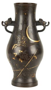 Asian Inlaid Bronze Vase: Japanese or Chinese inlaid bronze vase, baluster form with figural elephant head mask handles. Silver line inlay to neck and base and incised bird designs including a hawk and rooster, floral