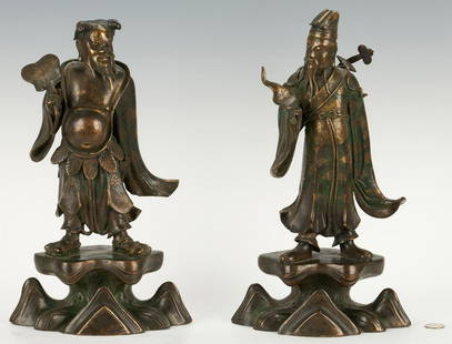 Pair of Daoist Bronze Figural Sculptures: Two (2) painted and gilt bronze Daoist figural sculptures, Chinese or Japanese. One figure holds a narrow leaf and wears a sword slung over his back, the other is bare-chested and holds a large