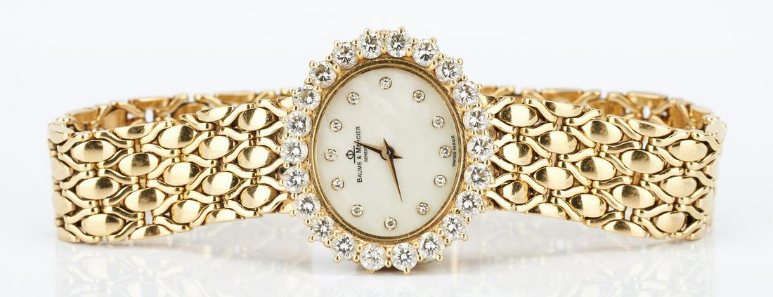 18K Baume & Mercier watch with Diamond Surround: Ladies Baume & Mercier watch with a diamond surround composed of 22 round brilliant diamonds approximately 3.3 carats, Clarity-SI2, Color-I. Marked "18K", "750", "SMO", "Geneve", and "Baume & Mercier"