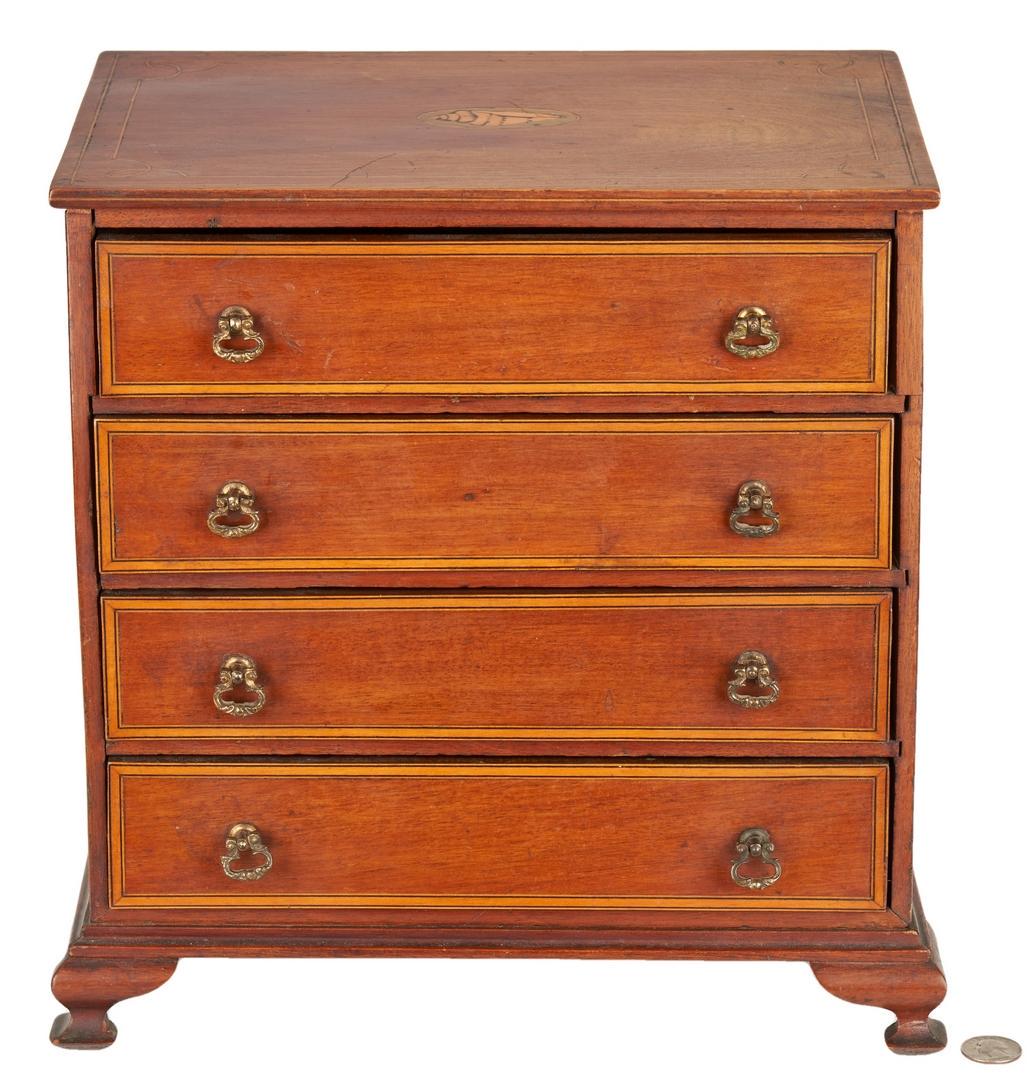 American Miniature Chest of Drawers, Shell Inlay: American miniature chest of drawers, mahogany primary, pine secondary. Rectangular top with central shell and string inlay over four (4) graduated dovetailed drawers with satinwood banding and line in