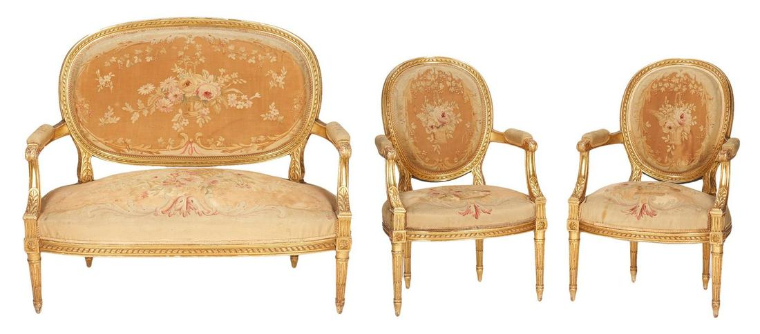 Louis XVI Style Gilt Carved Settee & 2 Arm Chairs: French Louis XVI Style Gilt Carved Settee & 2 Arm Chairs. Settee with giltwood frame having oval ribbon carved back, shaped padded armrests terminating in acanthus carved handrests; shaped seat and fl