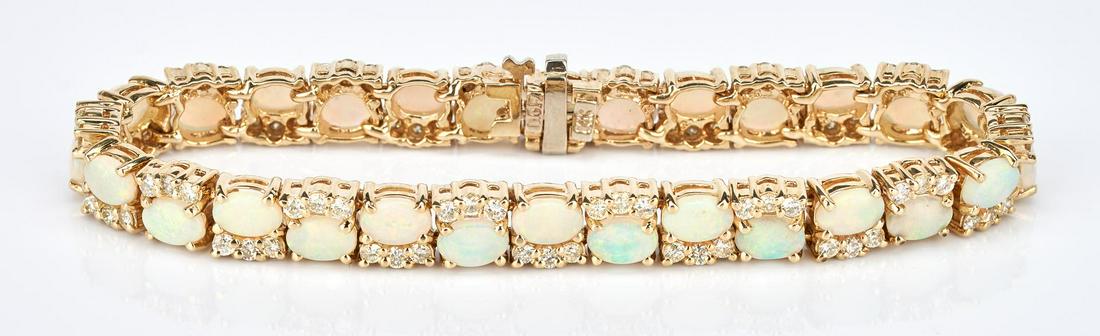 Ladies 14K Opal & Diamond Bracelet: One ladies 14k yellow gold opal and diamond bracelet set with a total of 28 oval semi-crystal natural opal cabochons measuring approximately 6.0 x 4.0 x 2.1mm and weighing approximately 7.84 carats, g