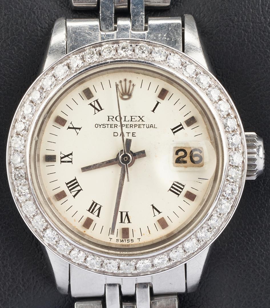 Ladies Rolex Datejust w/ Diamond Bezel: Ladies stainless steel Rolex oyster perpetual datejust wristwatch, model number 6517, with an after market diamond bezel containing 44 diamonds totaling 1 carat. Sapphire crystal, 26mm case, white dia