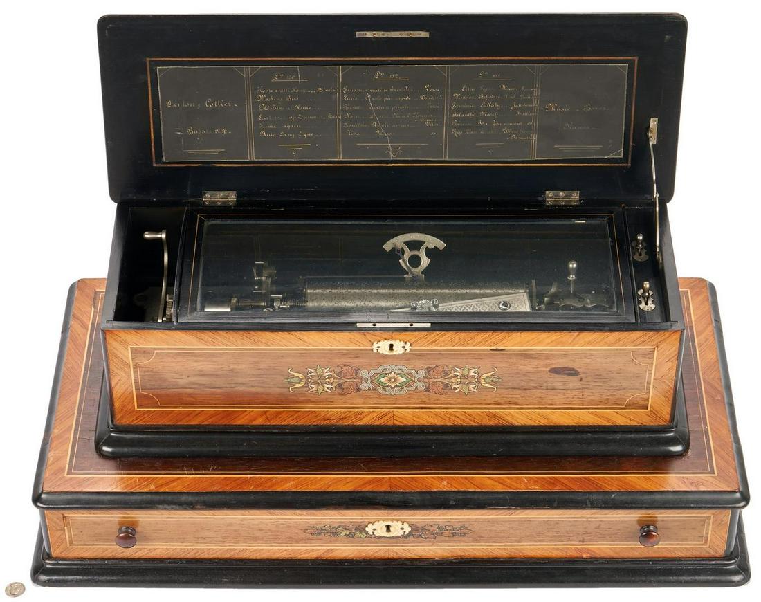 Swiss Marquetry Cylinder Music Box: Swiss interchangeable brass cylinder 6-tune music box, rosewood marquetry case having inlaid floral decoration to top and front and ebonized trim. Fitted with a steel comb and a lever winding mechanis