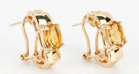 Ladies 14K Gold and Imperial Topaz Earrings: Ladies 14K yellow gold earrings featuring 2 oval natural imperial topaz approximately 2.72 carats. The earrings are marked "14K". The earrings are 3/4" H and have a gross weight of 5.44 grams.