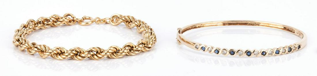 2 Ladies Gold Bracelets, 10K & 18K: 2 Ladies Gold Bracelets, 10K & 18K. 1st item: Ladies 10K yellow gold bangle bracelet featuring 8 round brilliant diamonds approximately 0.40 carats, Clarity-I1, Color-I. Marked "10K" and is 6 1/2" in