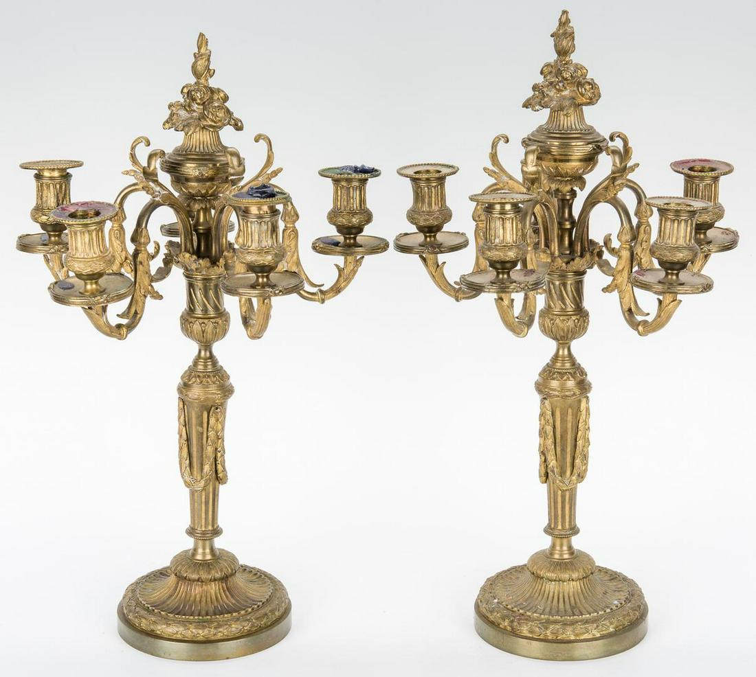 Pr. Neoclassical Style Gilt Bronze Candelabra: Pair of French Neoclassical style gilt bronze candelabras, comprised of 5 scrolled arms with central floral basket finial, raised on an urn and reeded standard with swag decoration and terminating int