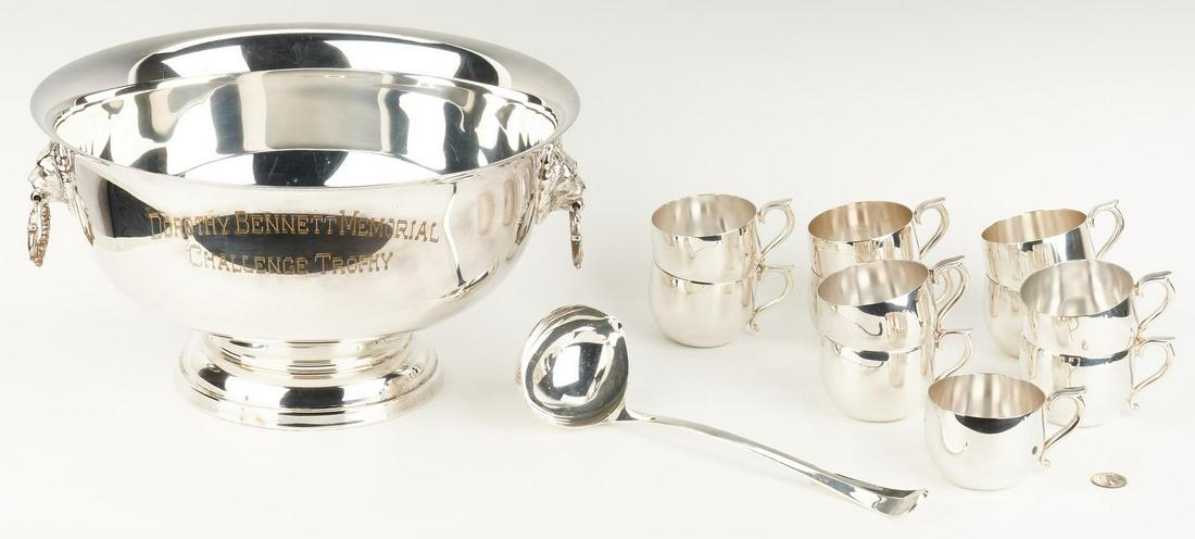 Horse Trophy Punch Bowl, Cups and Ladle: Silverplated Regency style punch bowl with lion's head handles, inscribed DOROTHY BENNETT MEMORIAL CHALLENGE TROPHY, together with 11 cups having plain circular bodies and C scroll handles, and a punc