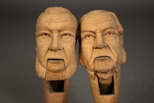 Carved folk art nutcrackers depicting man face