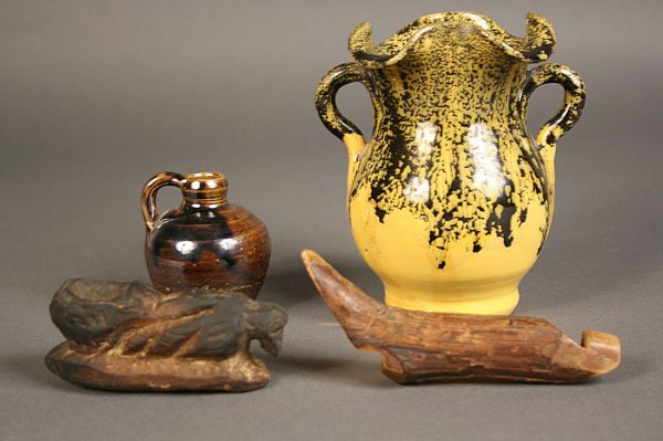 Folk art grouping of carvings and pottery