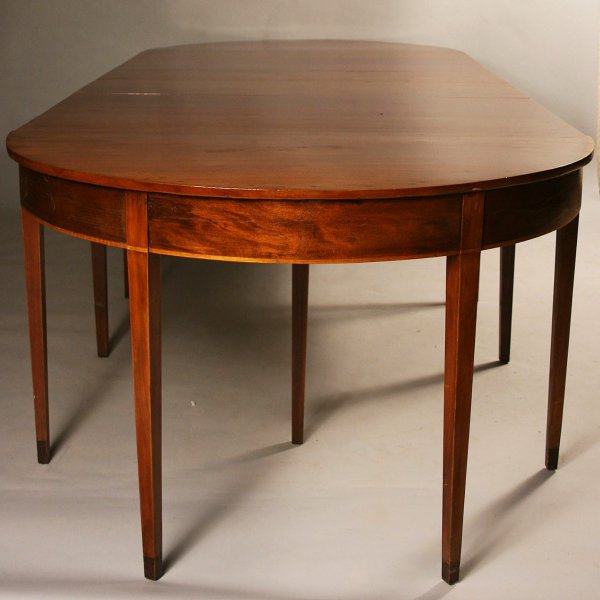 Hepplewhite style dining table: Hepplewhite dining table comprised of one period Hepplewhite end table and contemporary drop leaf center and end table. Condition - restoration to period end table including tipped feet. Some scratche