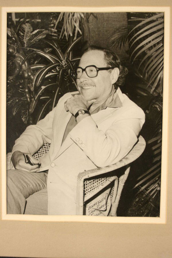 Photograph of Tennessee Williams: Photograph of Tennessee Williams. Inscribed in lower right margin "Tennessee, Don Pinder, r????????" Black & white photograph of Williams sitting with hand under chin, holding a pair of glasses. Miami