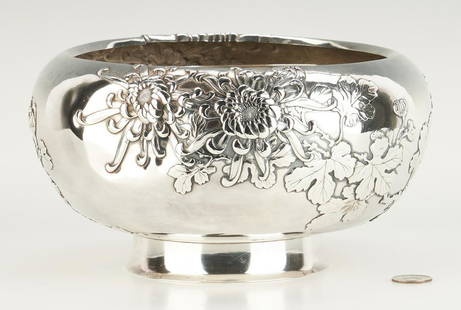 Japanese or Chinese Export Silver Bowl: Chinese or Japanese Meiji export silver footed bowl, the bulbous sides with detailed repousse decorations of chrysanthemums and leaves. Asian hallmark to underside. 5 1/2" H x 10" dia. 39.44 oz troy.