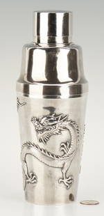 Chinese Export Silver Cocktail Shaker: Chinese export silver cocktail shaker with raised twin dragon decoration to the body, base stamped WH 90 for Wang Hing & Company, Hong Kong. 9 3/4" H. Late 19th/Early 20th century. 17.740 troy ounces.