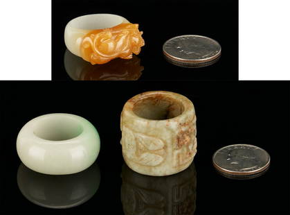 3 Chinese Jade Rings, incl. Dragon: Three (3) Chinese jade carved rings, including one (1) white jade ring with carved russet colored dragon decoration, one (1) mottled celadon and russet jade archer's ring with carved bee and symbol