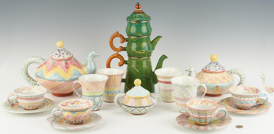 18 Pcs. MacKenzie-Childs Ceramic & Enamel Ware: Grouping of eighteen (18) MacKenzie-Childs ceramic beverage ware in various patterns, including one (1) coffee pot, one (1) teapot, one (1) creamer, four (4) coffee cups with four (4) saucers, and fou