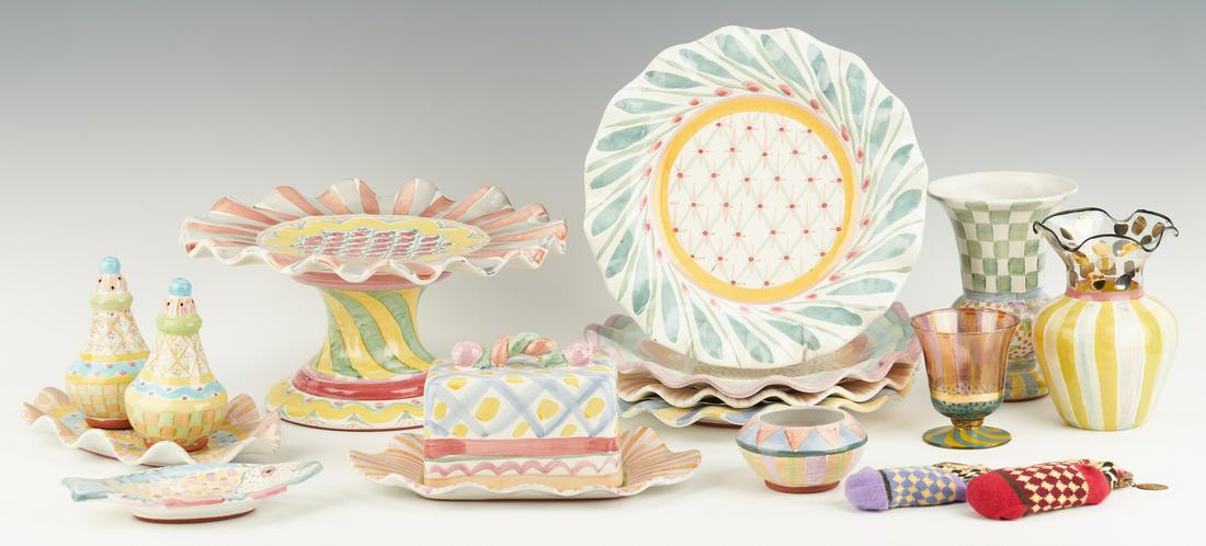 16 Mackenzie-Childs Ceramic, Glass & Other Items: Assorted grouping of sixteen (16) Mackenzie-Childs ceramic, glass, and knit items in various patterns, including four (4) ceramic dinner plates with ruffled rims; one (1) ceramic pedestal cake stand w