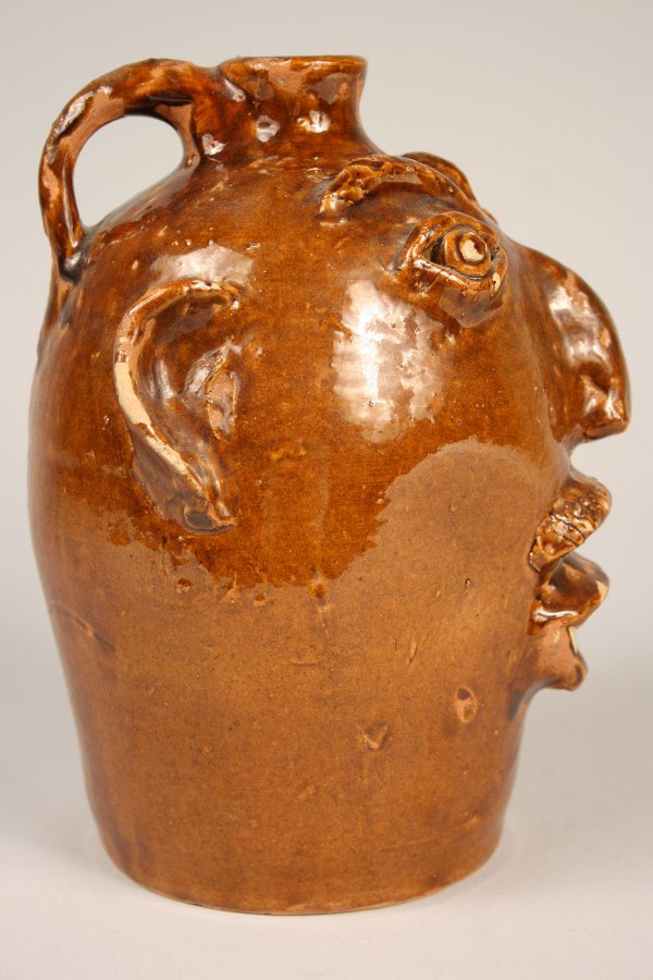 200 Brown pottery face jug, North Carolina Lot 200