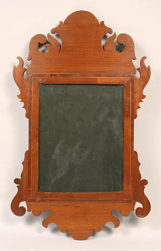 Chippendale mahogany looking glass, string inlay: Chippendale mahogany looking glass with string inlay surrounding glass. Condition - appears to retain the original mirrored glass, three of the returns are later replacements. 20 5/8" Height x 12 3/8"