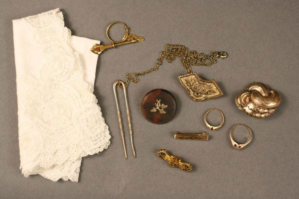 Victorian gold jewelry, 9 assorted pieces with albu: Lot of 9 pieces Victorian gold jewelry including hanky ring with jewel and handkerchief, chased and enameled handy pin, chased and enameled bar pin, chased and enameled watch pin, hairpin/spectacle ke