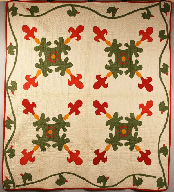 Applique Quilt, Leaf and bud variation: Four block leaf and flower bud variation appliqued quilt, red and dark gold solids with green calico, embroidered with circles and hearts. Thin red border, white cotton backing. Intricate hand stitchi