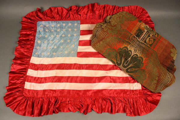 Civil War era carpet bag & American flag pillow sh: Civil War era carpet bag & American flag pillow sham, 42 stars. 1st item - Civil War era carpet bag, brass lock and leather handle (detached but retained). Jacquard pattern wool with divided interior