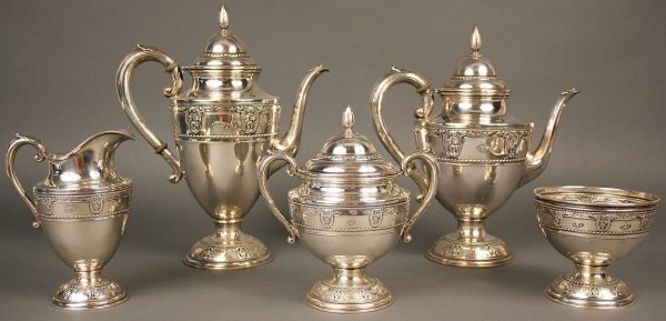 Wallace Rose Point sterling coffee and tea service: Wallace sterling tea set, Rose Point pattern. 5 pieces total. Includes teapot(11" Height), coffeepot (12" Height), sugar (7 1/2" Height), creamer (6 1/2" Height), and waste bowl (4 1/8" Height). Overa