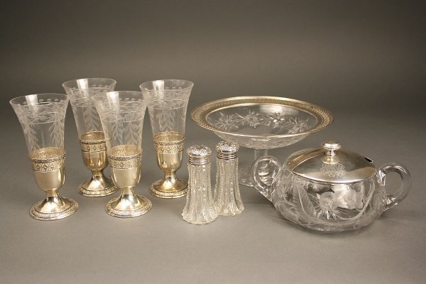 Assorted cut etched glass and silver tableware: Assorted cut etched glass and silver tableware. 1st item - Double handled cut glass preserve jar with etched thistle design and monogrammed silver cover marked sterling (no ladle). 3" height x 5" diam