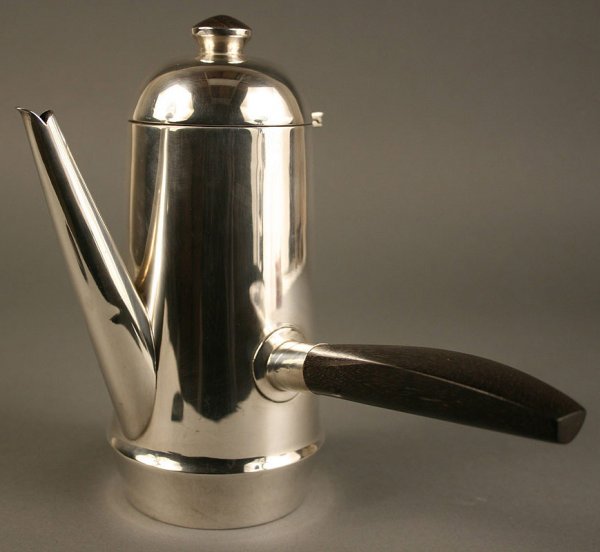 William Spratling sterling silver coffee pot: William Spratling coffee pot, sterling with wooden handle and finial, with stamped mark "William Spratling, Taxco, Mexico" and shield hallmark. Includes original bill of sale from 1960. Condition 