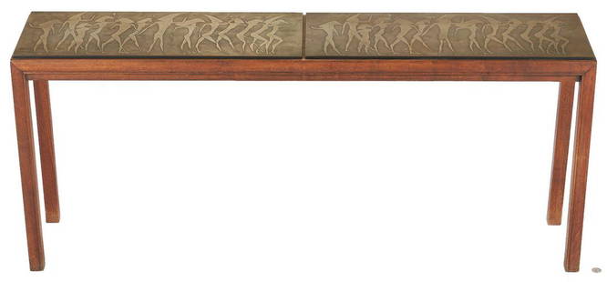 Mid-Century Console Table by John Stuart: Mid-Century console table by John Stuart, Inc. The top with two applied rectangular metal plaques with carved stylized Egyptian figural decoration over a hardwood base (appears to be a walnut