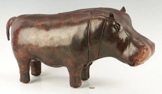 Leather Hippo Foot Stool, Attrib. to Dmitri Omersa: English stitched leather figural footstool in the shape of a hippo, feet fitted with copper button caps. Attributed to Dmitri Omersa. 13" H x 24" L. 4th quarter 20th century. Provenance: the estate