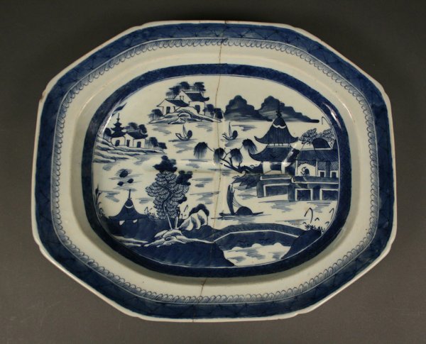 Canton Porcelain Meat Platter: Canton octagonal porcelain well-and-tree meat platter. Condition - Old break with metal staple repair. Old chip to rim. 13 1/4" H x 16 1/2" W. Chinese, 19th century.