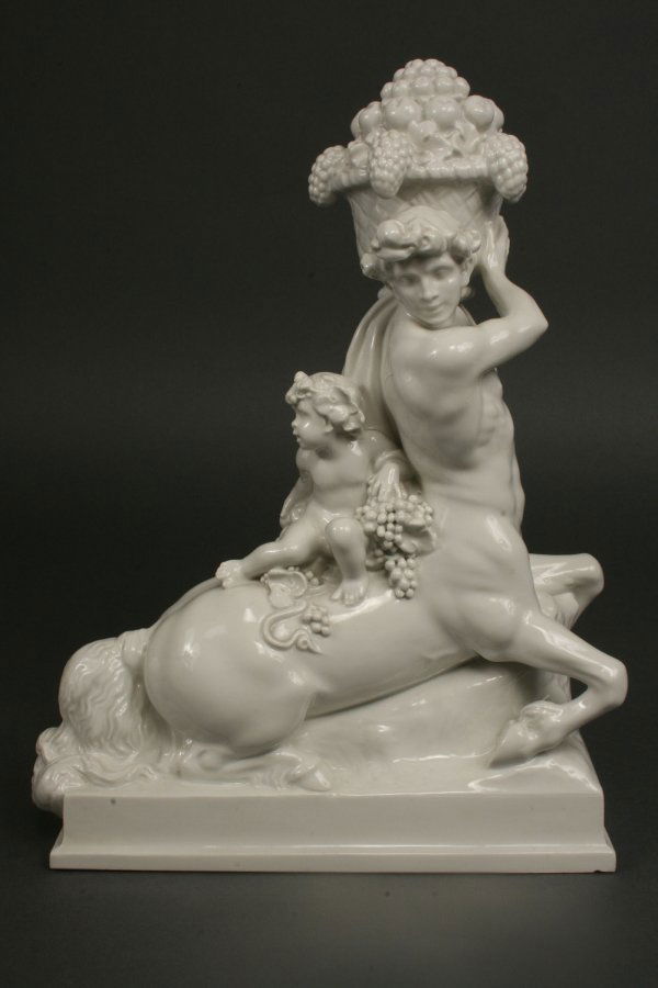 German Porcelain Centaur and Bacchus Figure, KPM: German Glazed Porcelain Centaur m. jungem Bacchus Figure by Wilhelm Widemann - KPM, Berlin 1913. Incised with "W. Widemann" and "08101" Overall very good condition, with small nick noted on base rim a