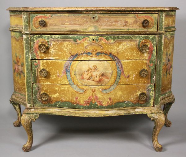 Painted Italian Bombe chest: Italian painted Bombe four drawer chest with shaped top and sides and raised on cabriole legs. Paint decorated with cherubs and floral sprays. Overall good condition with expected wear and losses to p