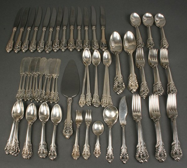 111 pcs Sterling Silver Grand Baroque flatware, Wa: Flatware service for 12 plus extras, marked Wallace Sterling, no monograms. 13 dinner knives with stainless blades (8 3/4"), 13 flat handle all silver butter spreaders, 12 dinner forks (7 3/8"), 16 sa