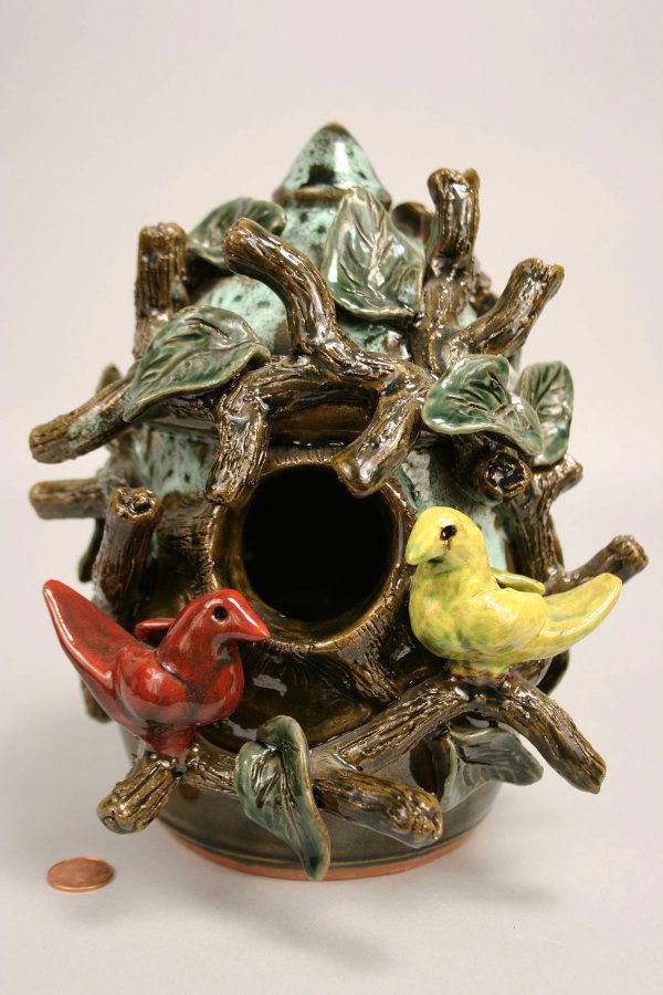 Folk pottery bird feeder, Wayne Crocker: Georgia Folk pottery bird feeder by Wayne Crocker. Elaborate form with applied leaves, branches and birds with white drips over alkaline glaze. Signed on base "Wayne L. Crocker, 2004". 8 1/2" H. Prove