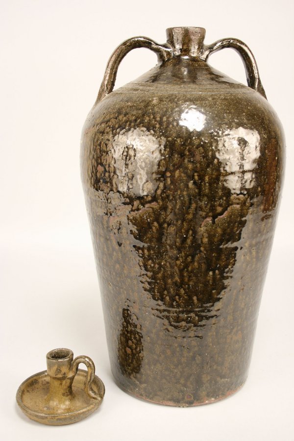 Cleater Meaders alkaline glazed pottery grouping: Two Piece Grouping of Georgia Folk Pottery, Cleater Meaders. 1st item - tall two handled alkaline glazed jug, signed on bottom, Cleater Meaders. Overall very good condition. Measures 18" H x 7 1/4" Ba
