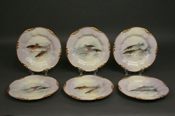 Set of Six Limoges Fish Plates: Set of Six Wm. Guerin & Co. Limoges Gilt Enameled Porcelain plates with various hand painted fish motifs on each plate. Marked J. P. L. France". Condition, Very Good. Measures 9 1/2" Diameter. Late 19