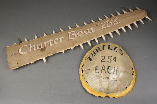 Lot of two trade signs: Lot of two trade signs. 1st item - Turtle farm trade sign comprised from turtle shell, painted, reading " Turtles 25 cents each. Food 10 cents per bag". Very good condition with some age cracks and we