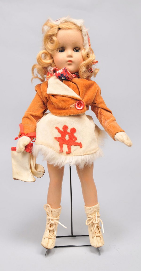 Sonja Henie doll, original clothes and skates : A Sonja Henie doll, all original with velvet coat, appliqued skirt, socks, mittens, hat and skates. All composition with blue sleep eyes, blonde curly wig. Probably Madame Alexander or Arranbee. Condi