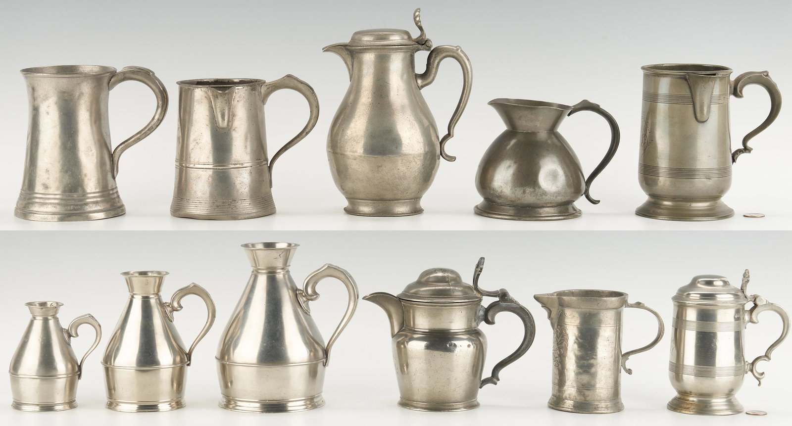 11 Pcs. Pewter Flagons, Tankards, Jugs and Measures: Eleven (11) English, Dutch and other European pewter pitchers and drinking vessels. Includes: four (4) handled haystack measures, including three (3) Austen and Sons (Irish, 19th century); three (3) l