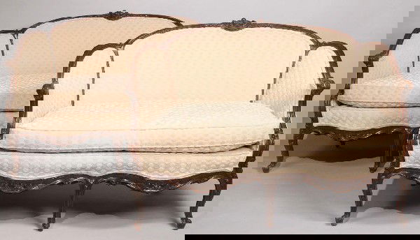 Pair of Louis XV Upholstered Settees, 19th century: Pair of Louis XV style upholstered settees. Cream chenille upholstery with foliate carved wood frame and cabriole legs. Occasional cracks and scratches to wood, some slight wear to upholstery. Measure